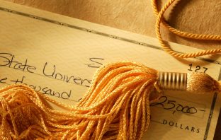 In-State Tuition for Illegal Aliens to be on Arizona 2022 Ballot Gold tassel on a check written for college tuition